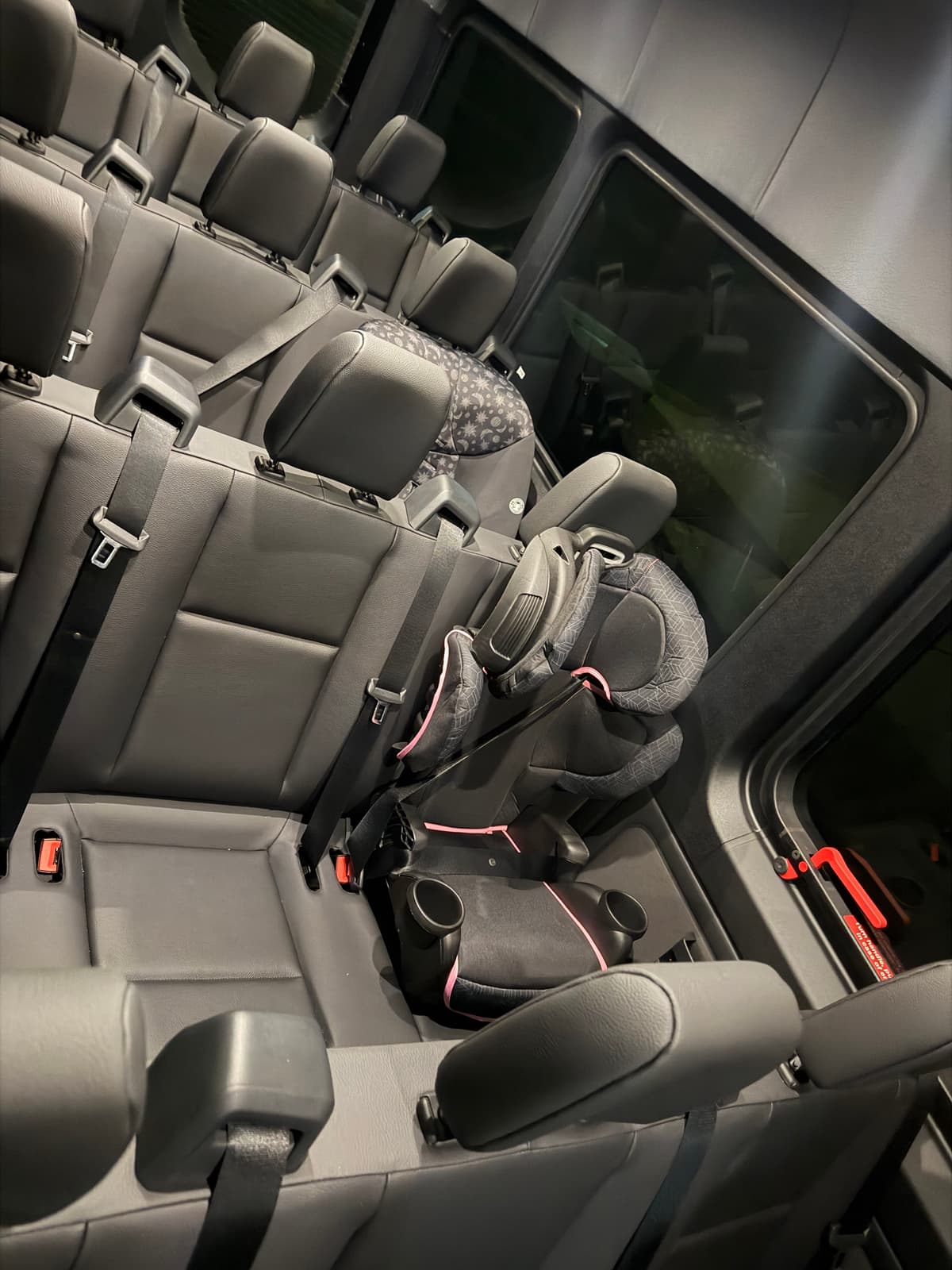 Car seat installed in luxury vehicle for Disney World transportation
